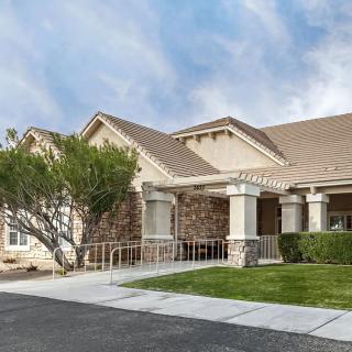 A suburban house with a well-maintained front yard and driveway.