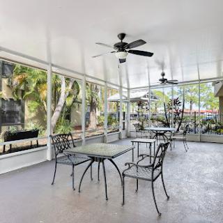 A serene outdoor patio featuring comfortable furniture, perfect for enjoying nature.