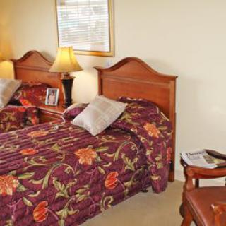 A cozy bedroom with twin beds and floral bedspreads.