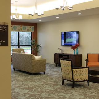 A cozy and modern living room with comfortable seating and a television.