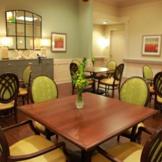 A cozy dining area with elegant furniture and tasteful decor.