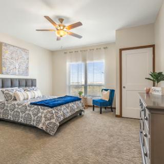 A beautifully designed bedroom featuring a comfortable bed, stylish decor, and a cozy atmosphere.