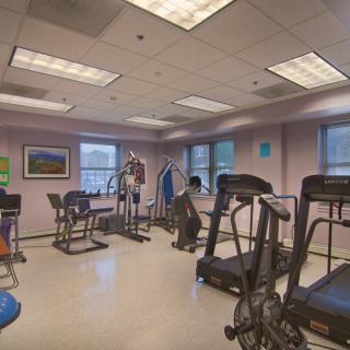 A fitness center equipped with treadmills and stationary bikes.