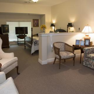 A cozy living room with comfortable seating and soft lighting.