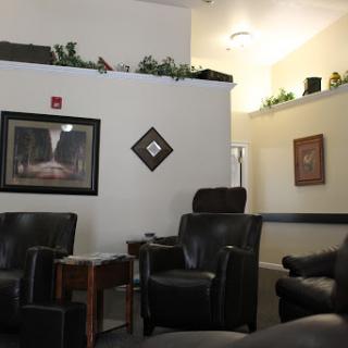 A cozy waiting area with comfortable chairs and a calm atmosphere.