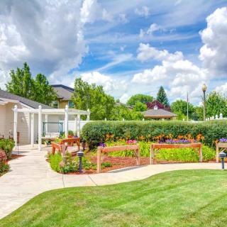 Beautiful garden landscape with a well-maintained lawn and pathway.