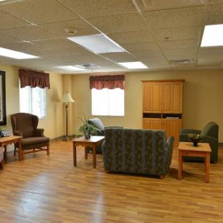 A spacious lobby area featuring comfortable seating and ample natural light.