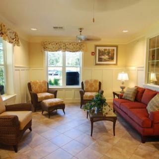 A cozy living room with comfortable seating and warm lighting.