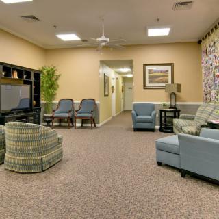 A cozy living room with comfortable seating and a television.