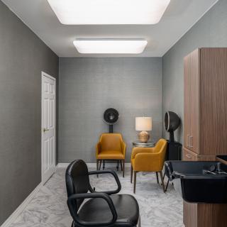 Modern salon interior with stylish chairs and a minimalistic design.