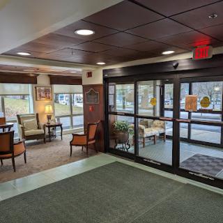 A cozy and inviting lobby area with comfortable seating, perfect for relaxing or waiting.