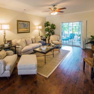 A cozy living room with elegant furniture and natural lighting.