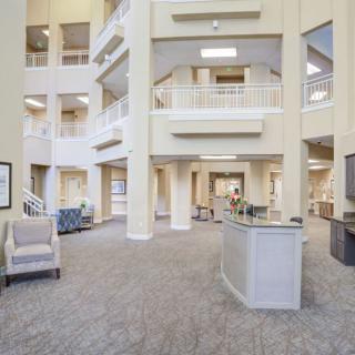 A spacious and modern lobby with bright interiors and comfortable seating.