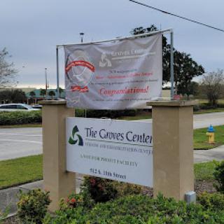 A sign for The Care Center, featuring an announcement banner.