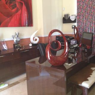 Modern office space with stylish decor and artwork.