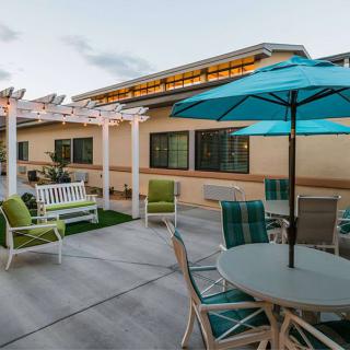 A cozy patio area with seating and umbrellas, perfect for relaxation.