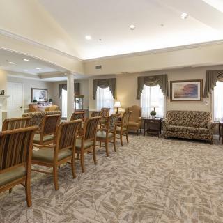 A spacious waiting room with seating arrangements and soft lighting.