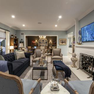A beautifully decorated living room with elegant furniture and a cozy ambiance.