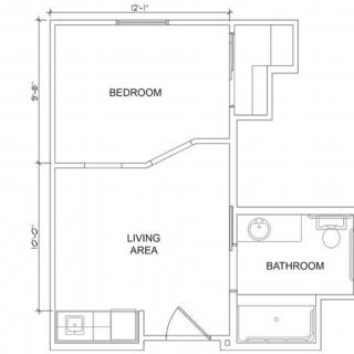 Blueprint of a small apartment with a bedroom, living area, and bathroom.