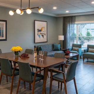 A modern dining and living area with stylish furniture and decor.