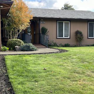 A cozy home with a well-maintained front yard.