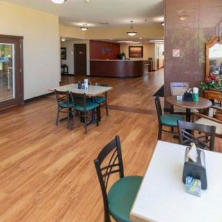 A casual dining area with wooden floors and a welcoming ambiance.