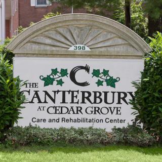 A sign for The Canterbury at Cedar Grove Care and Rehabilitation Center.
