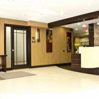 A modern reception area with a sleek desk and contemporary decor.