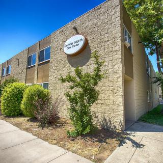 Exterior view of a school building on a sunny day.