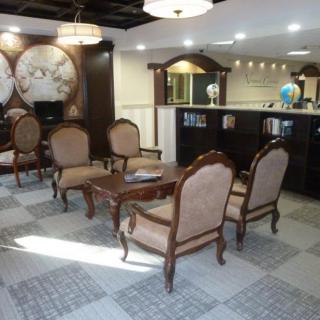 A comfortable lobby area with elegant furniture and a reception desk.