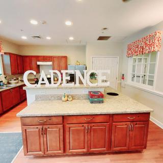 A spacious kitchen with wooden cabinets and a central island.