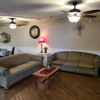 A cozy living room setup featuring comfortable sofas and a warm ambiance.