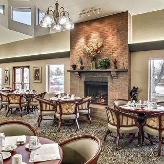 Elegant dining area with a cozy fireplace and sophisticated decor.