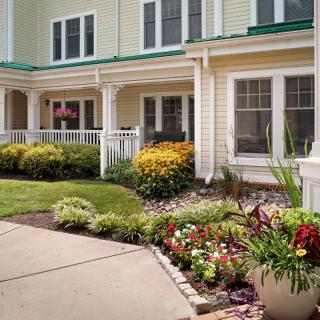 A charming house with a well-maintained garden and a cozy porch.