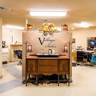 A vintage-themed salon interior with classic furniture and decor.