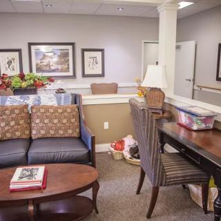 A cozy waiting room with comfortable seating and tasteful decor.