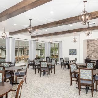 A spacious dining room with elegant decor and ample seating.