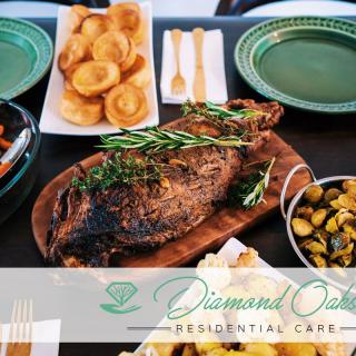 A delicious roast dinner with a variety of side dishes elegantly arranged on the table.