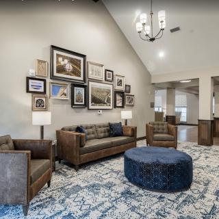 A stylish living room with comfortable seating and decorative wall art.