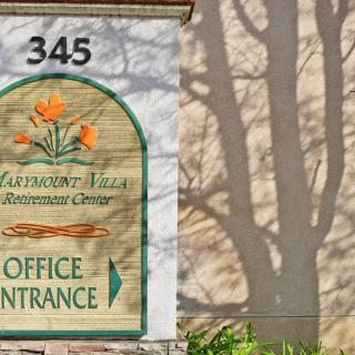 Sign for Claremont Villa with an office entrance indication.