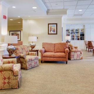 A cozy hotel lobby with comfortable seating and warm lighting.