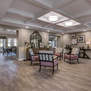 A modern living room with comfortable seating and elegant decor.
