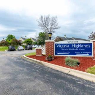 Entrance to the Virginia Highlands community, featuring well-maintained landscaping and a welcoming sign.