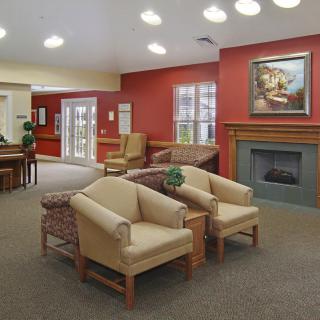 A cozy living room with comfortable seating and a fireplace.