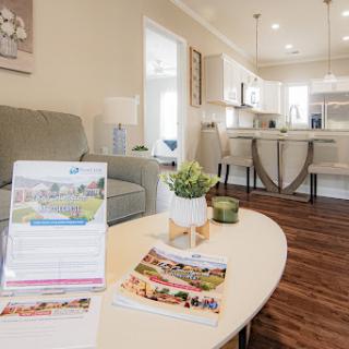 A stylish modern living space showcasing an open concept design with comfortable furnishings and decor.