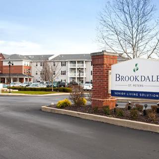 Entrance to a residential complex with a sign for Brookdale Senior Living.