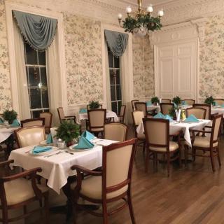 An elegant dining room with neatly arranged tables and sophisticated decor.