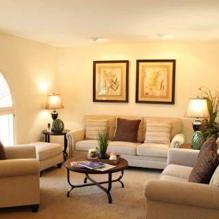 A cozy living room with elegant decor and comfortable seating.