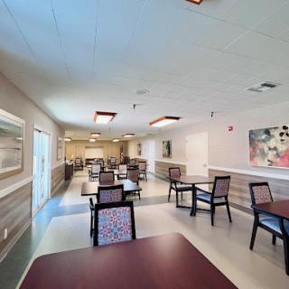 A spacious dining area featuring modern furniture and a welcoming atmosphere.