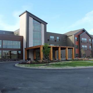 A modern building with large glass windows and a welcoming entrance.
